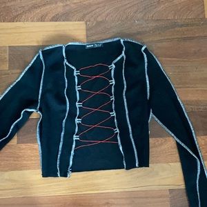Black long sleeve top with red lace